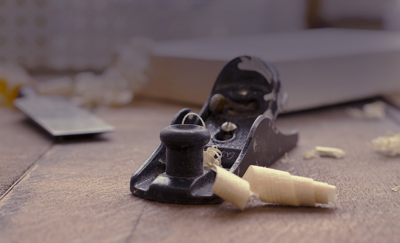 Hand-planing timber in the workshop