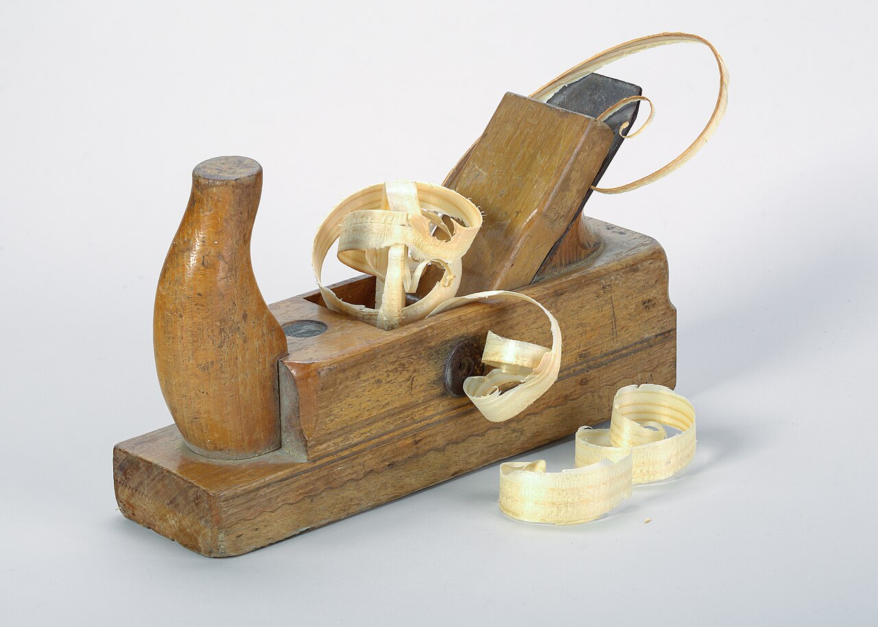 Selection of hand tools in the workshop, used for cutting joints and finishing details.