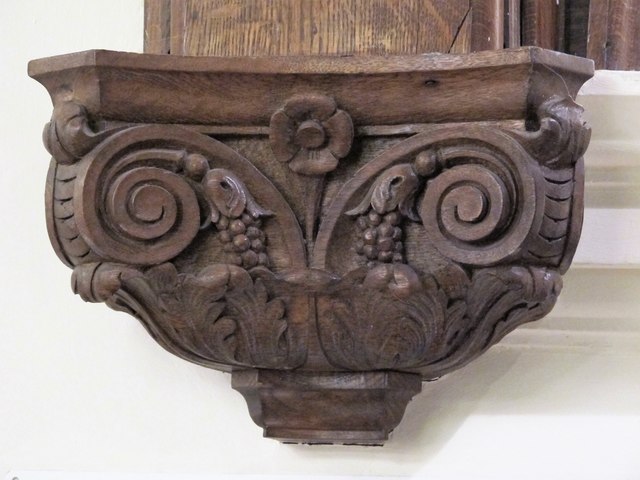 Oak staircase detail: handrail and balusters, hand-finished with wax.